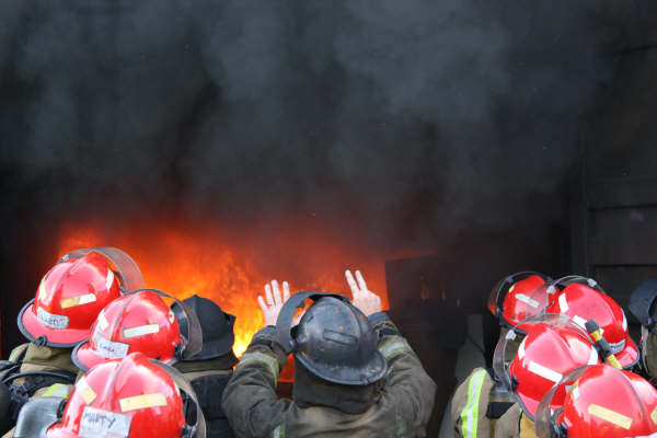 SSO Gary Luff instructs recruits during a container fire at Woolston Training Centre